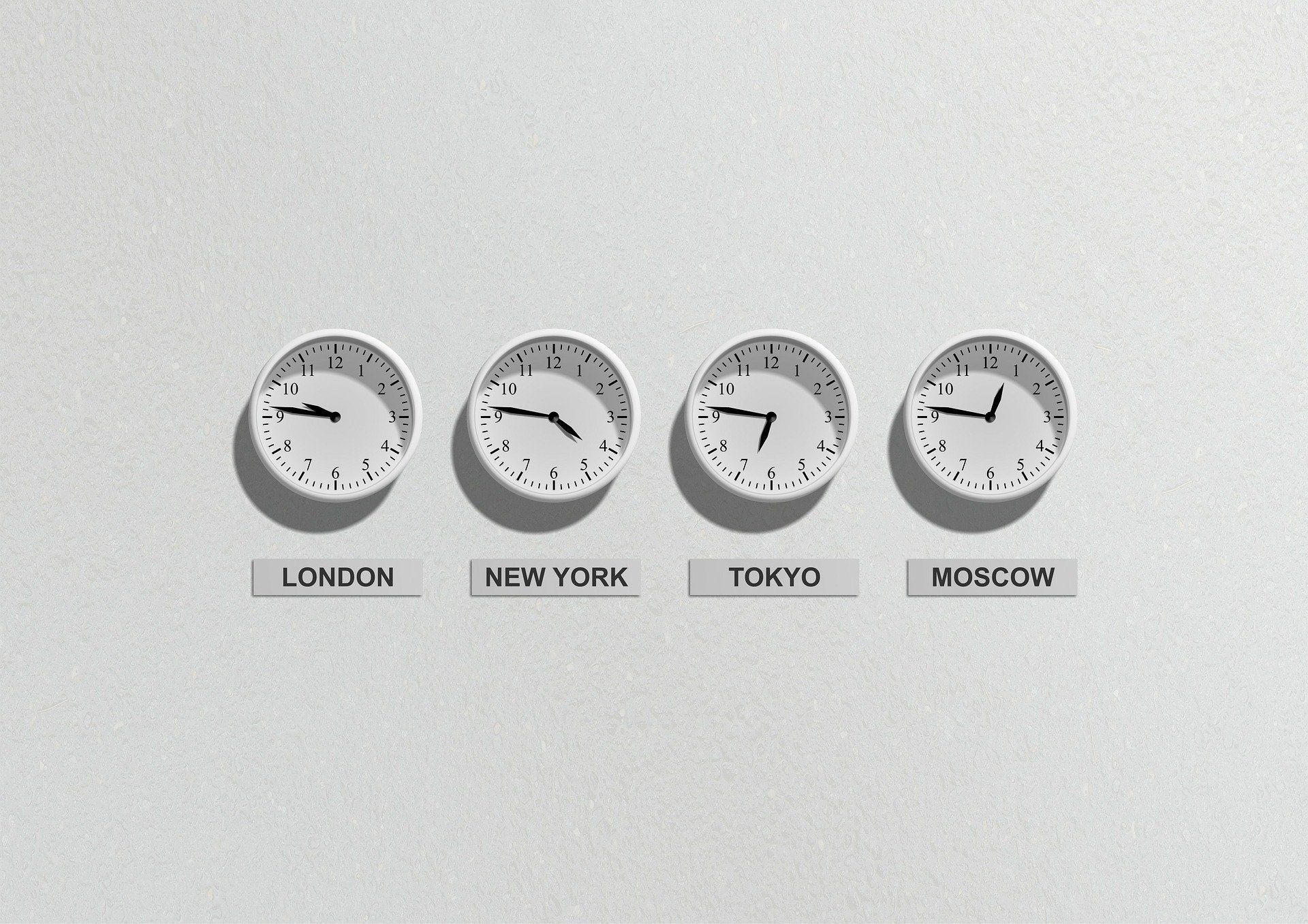 Photo of clocks set to different timezones